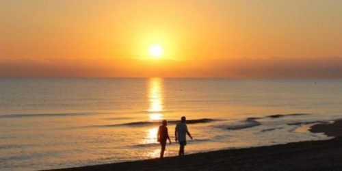 couple walking at sunset