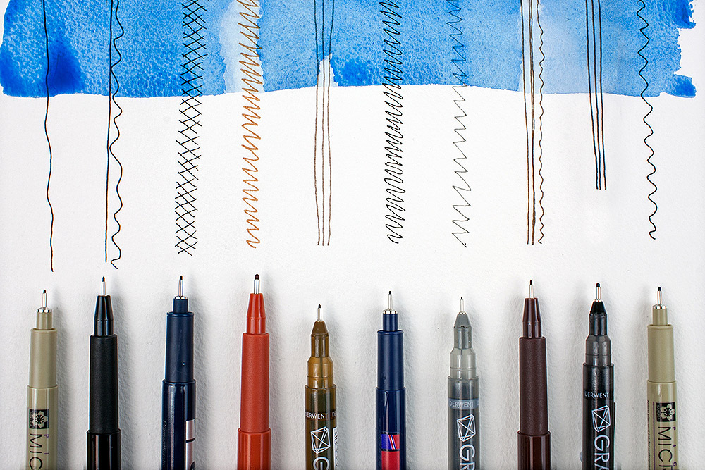 Selection of artists' fine liner pens with watercolour wash.