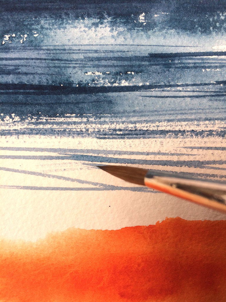 Using the point of the brush, to add a few crisp lined marks to the sea