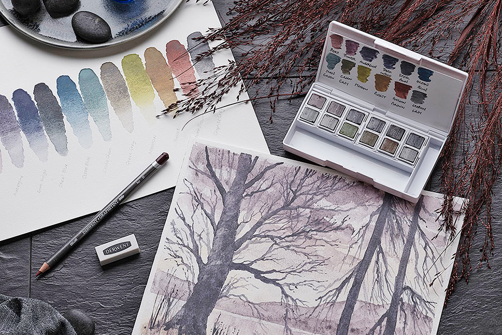 Combine the drama of graphite and the beauty of subtle colour with the Derwent Graphitint Paint Pan Travel Set