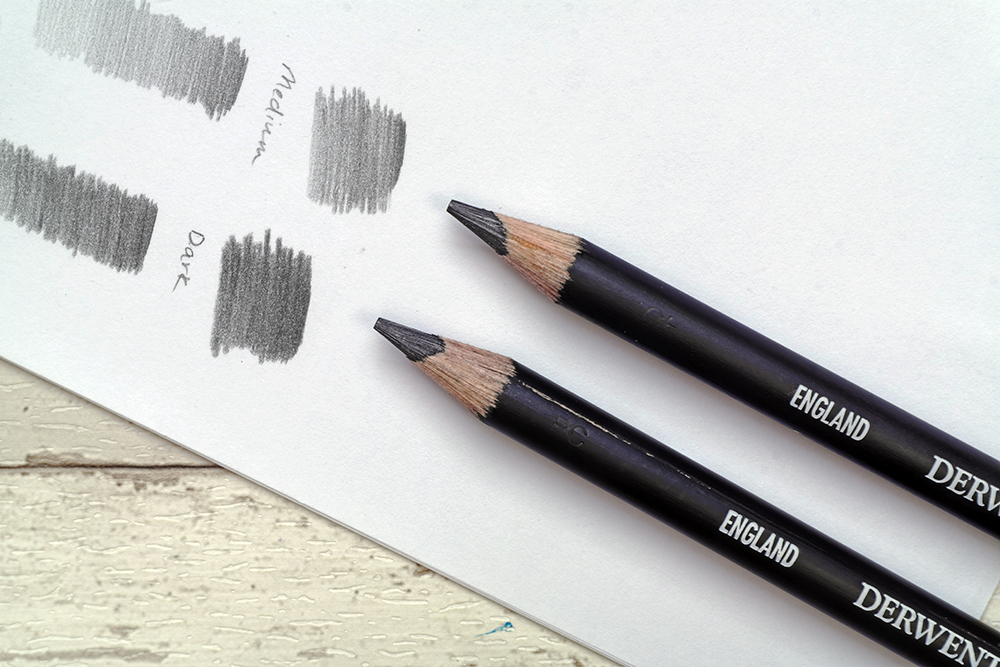 The full range of Derwent Onyx Graphite drawing and sketching pencils with swatches