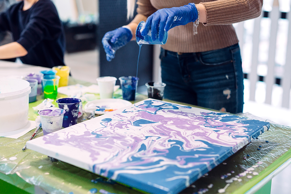 Artist acrylic pour painting on a traditional stretched canvas