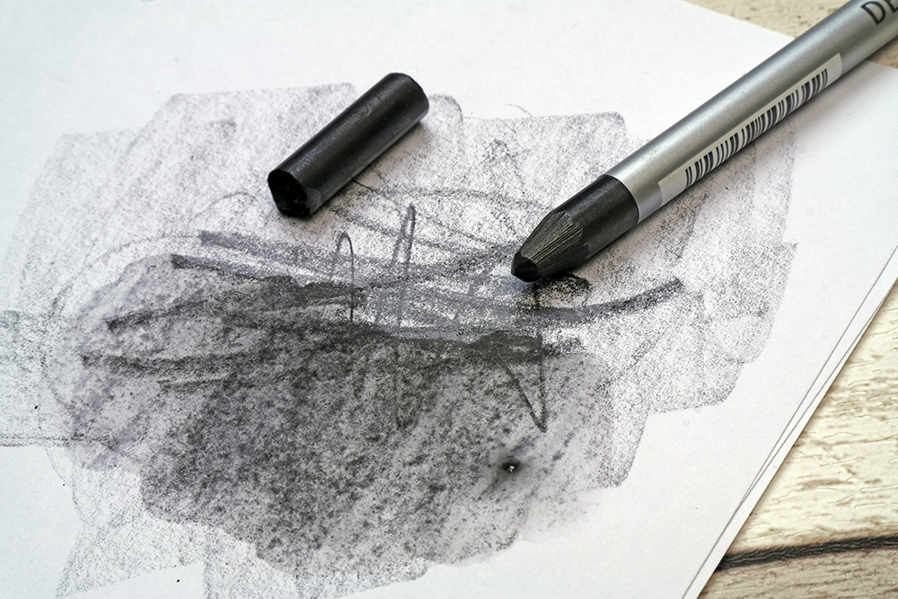 A 6B Dark Wash Derwent Graphitone stick split into chunks and used with water