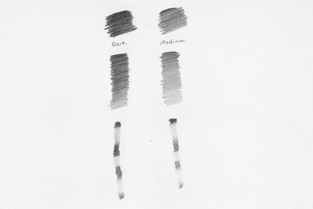 Swatches of Derwent Onyx Graphite drawing and sketching pencils in Dark and Medium