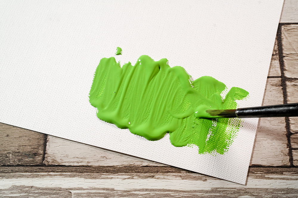 Green Soft Body Acrylic Paint applied to Fabriano Tela Paper with a brush