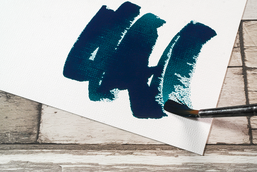 Turquoise Acrylic Ink applied to Fabriano Tela Paper with a brush