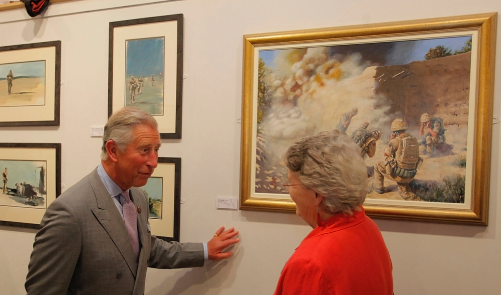 HRH Prince of Wales and Alix Baker discussing a painting by the artist at Mall Gallery
