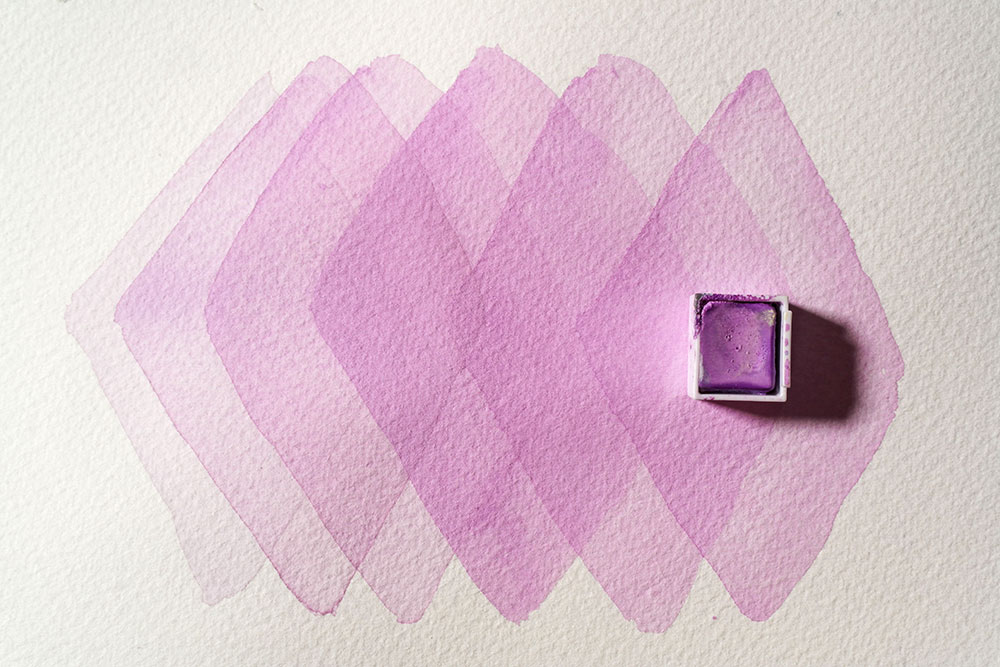 Dilute swatches of Lavender Pastel Shade are layered. Where the layers overlap the colour is more intense.