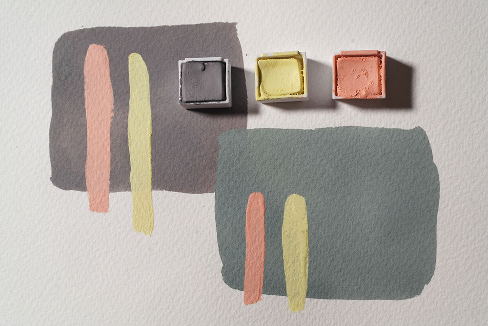 Opaque strokes of Coral Pink and Lemon have been painted over the top of dark swatches of Storm Grey and Artichoke mixed with Storm Grey.