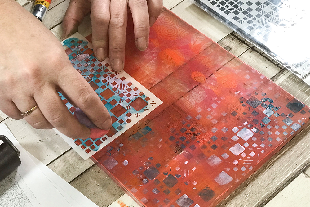 Gel Printing with Stencils - applying paint over small stencil