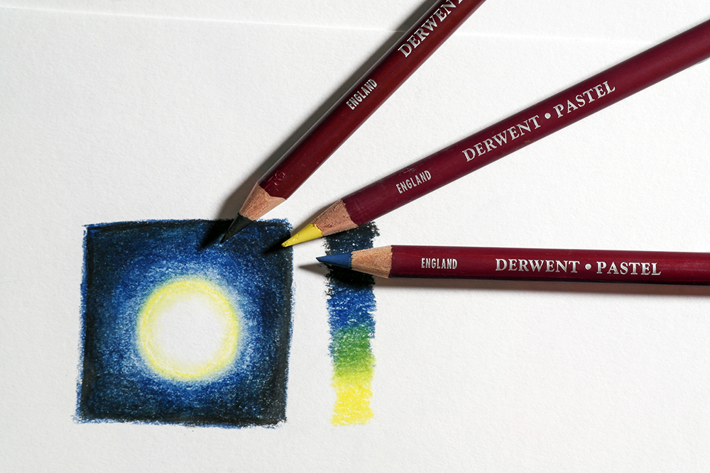 Juxtapose different values, light and dark shades to create contrast - black, blue and yellow pastel pencils are photographed next to a small sketch of contrasting shades.