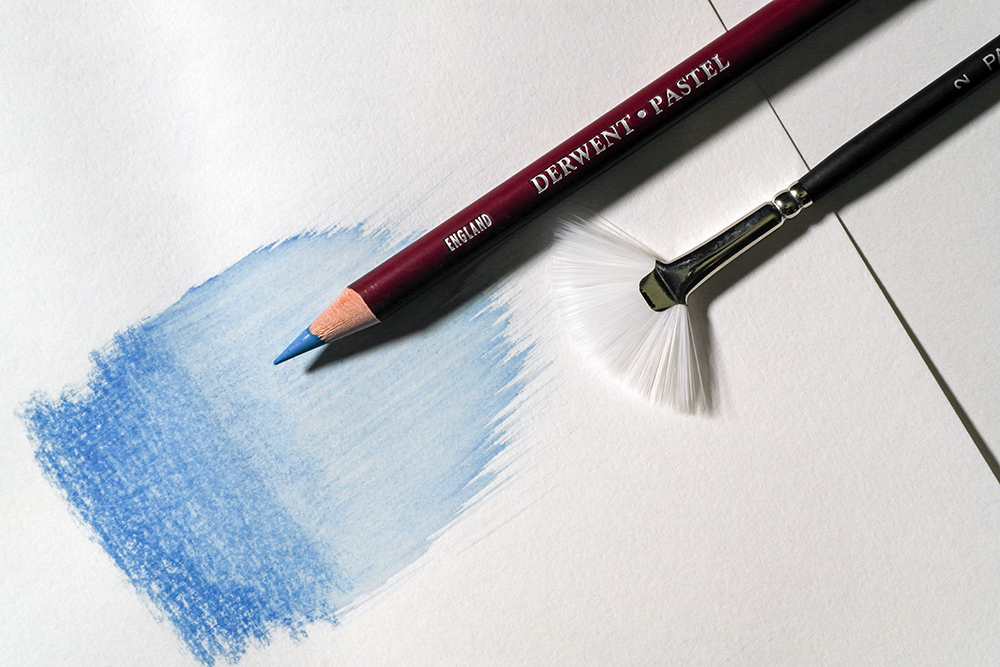 Try out Wet Brushing - a wet fan brush has been used to 'brush out' blue pastel to create a pale wash of colour.