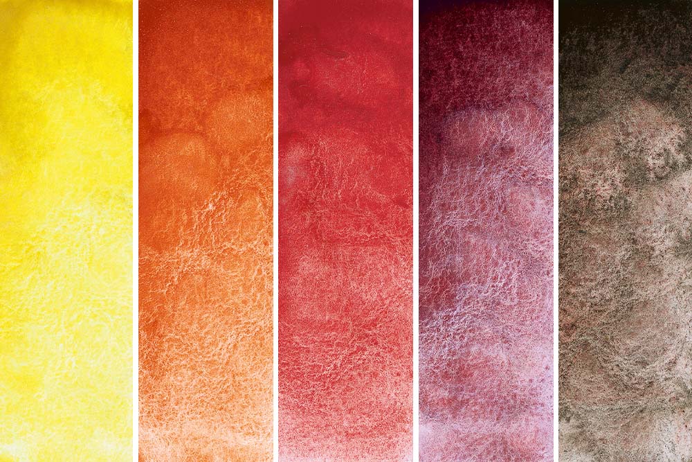 Schmincke Horadam Aquarell Super Granulating Watercolour Paints 5 Volcano Colours. From left to right - Volcano Yellow, Volcano Orange, Volcano Red, Volcano Violet and Volcano Brown.