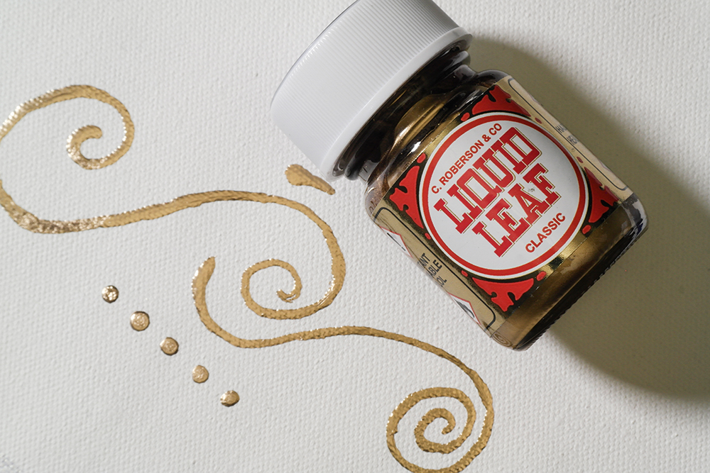 Image of Liquid Leaf applied with a striping brush or ruling pen to create fine lines and scrolls.