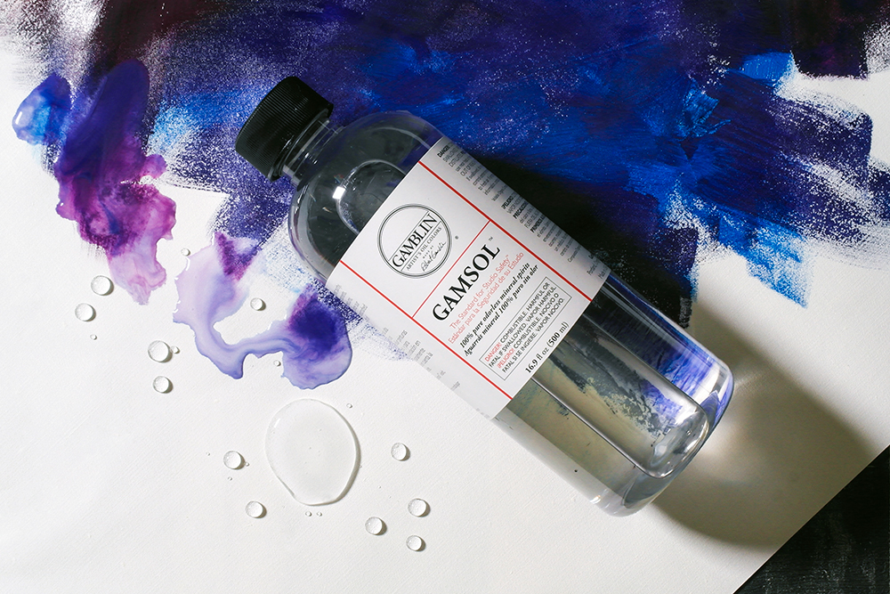 Gamsol Odorless Mineral Spirit on a background painted with oil paint.