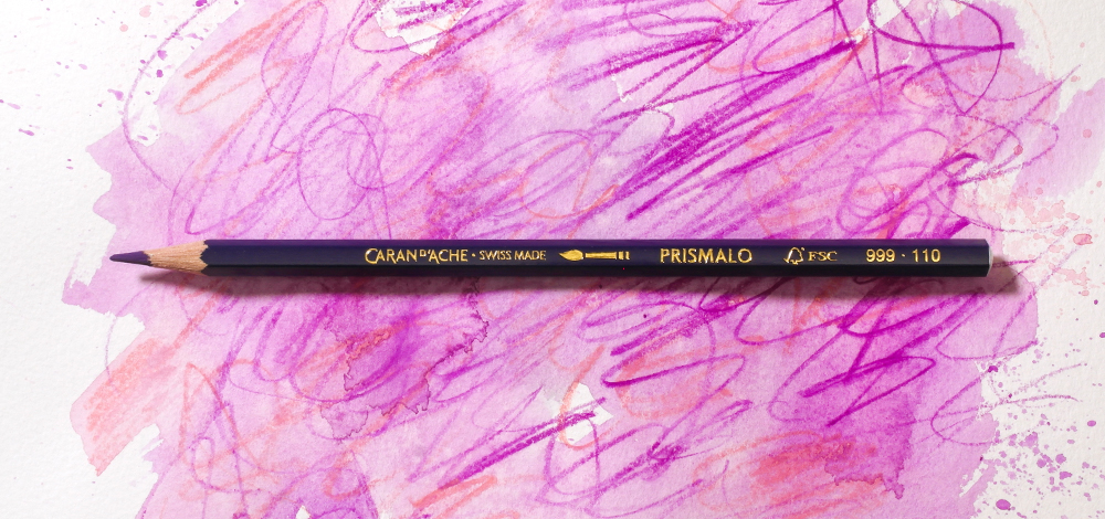 Caran d'Ache Prismalo Wax Based Watercolour Pencil on a colourful background