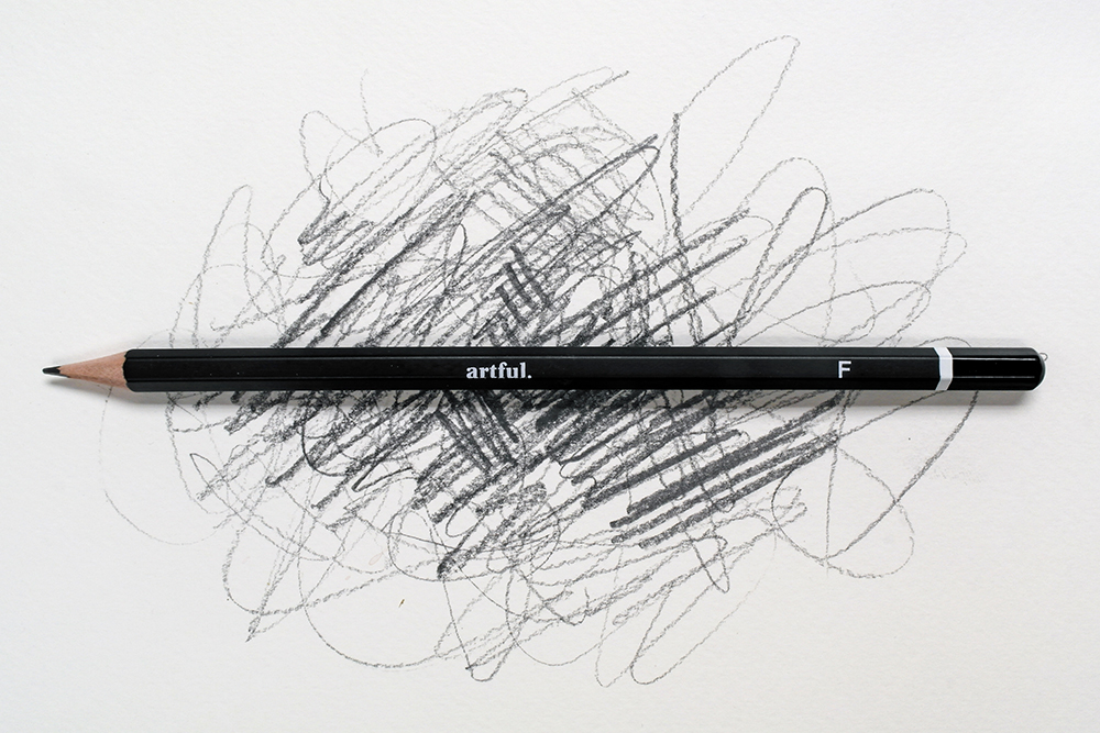 Artful F Grade Graphite Pencil on a scribbled background