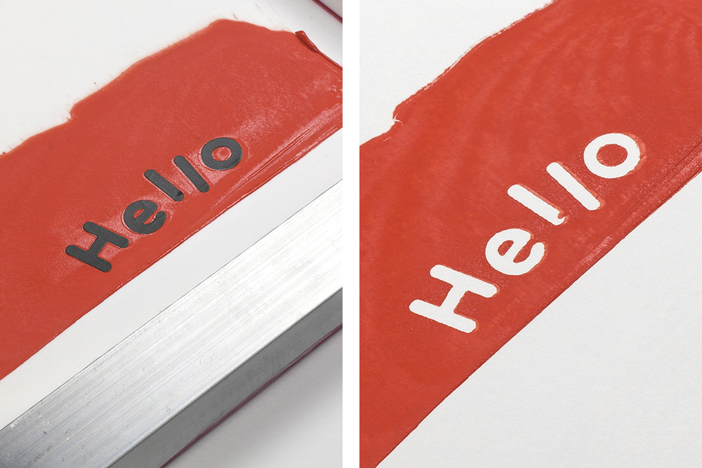 Vinyl decals spell hello and have been used to screen print a design