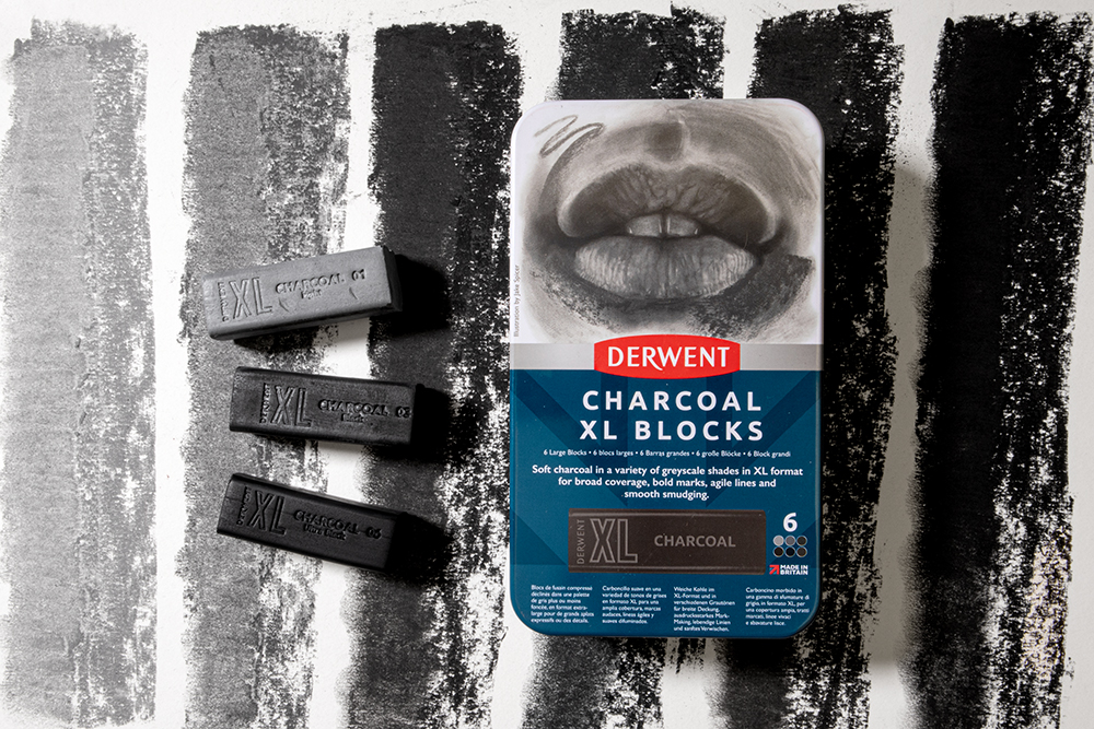 Derwent Charcoal XL Blocks on a background with swatches