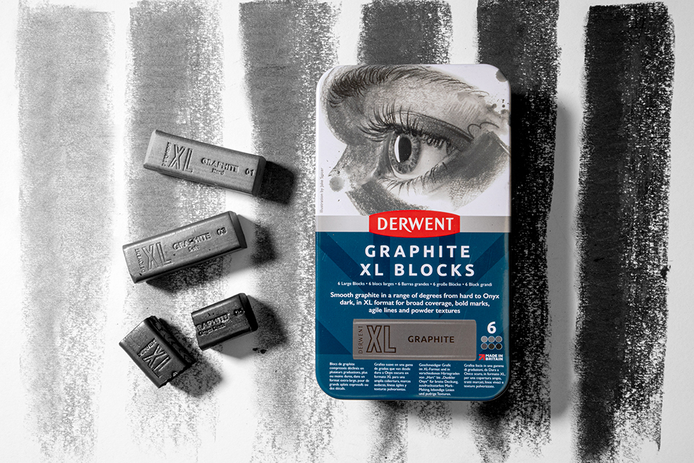 Derwent Graphite XL Blocks on a background with swatches