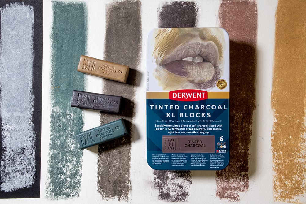 Derwent Tinted Charcoal XL Blocks on a background with swatches