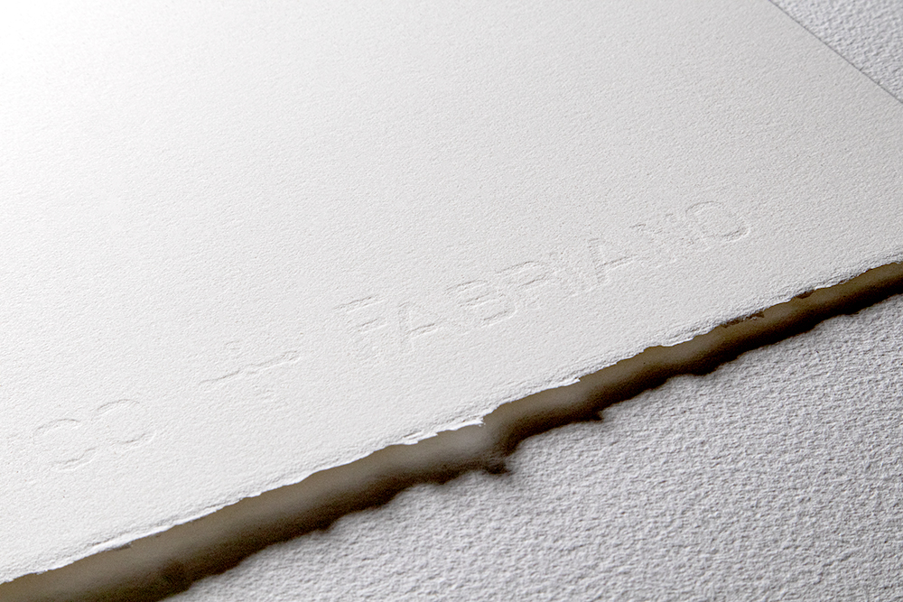 A detailed photo showing the watermark and deckled edge of a Fabriano Artistico Watercolour Paper Sheet