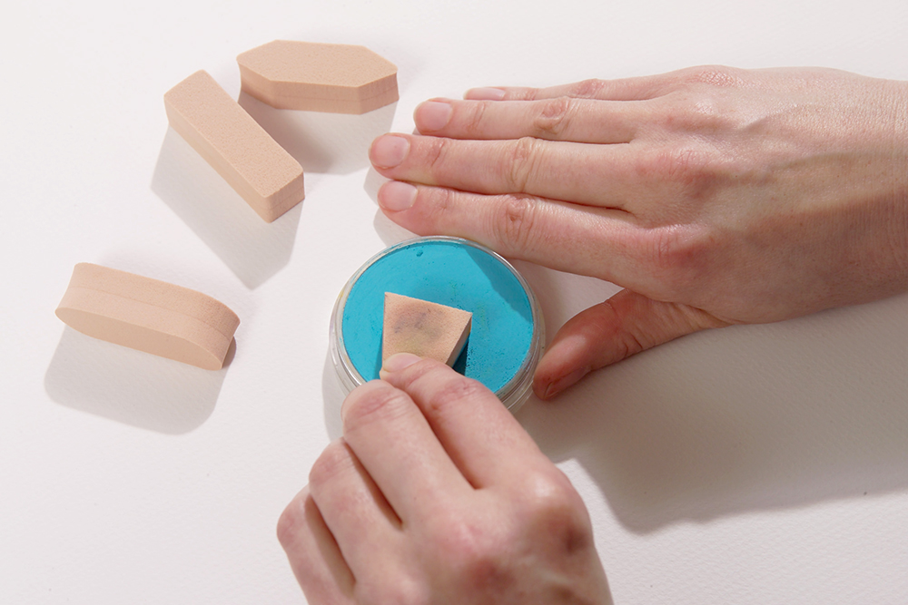 Artist using a Sofft Sponge to apply Blue PanPastel